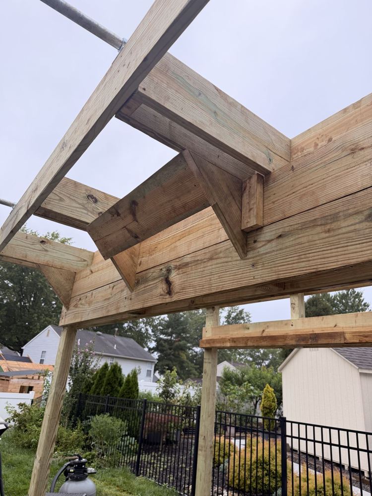 Close-up of angled timber braces at the corners of a ninja rig frame