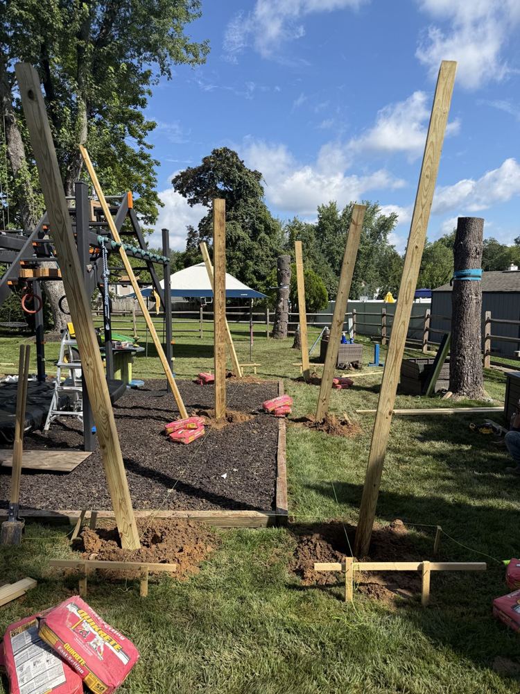 Posts set and braced in a backyard